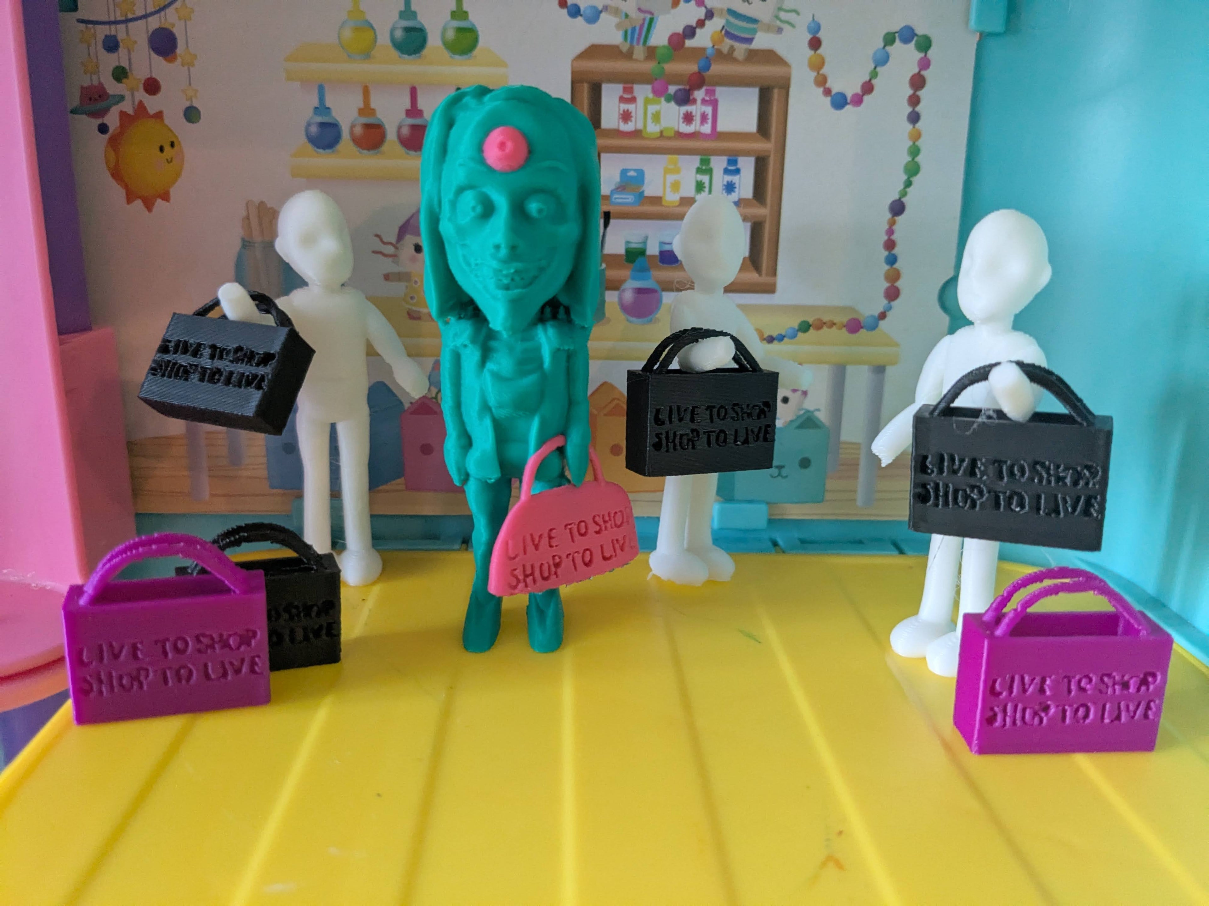 Colorful toy figures with signs and bags on a yellow surface, with a colorful backdrop.